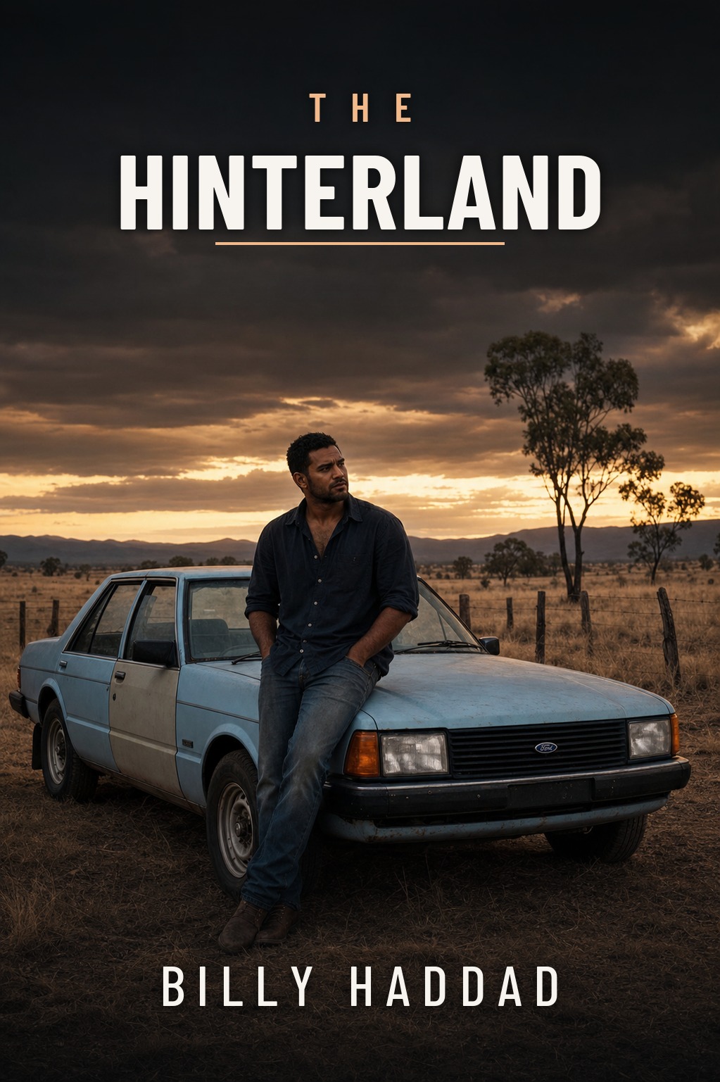 Cover of The Hinterland by Billy Haddad — Detective Darren Parsons sitting on the bonnet of his powder-blue XD Falcon on the Atherton Tablelands at dusk